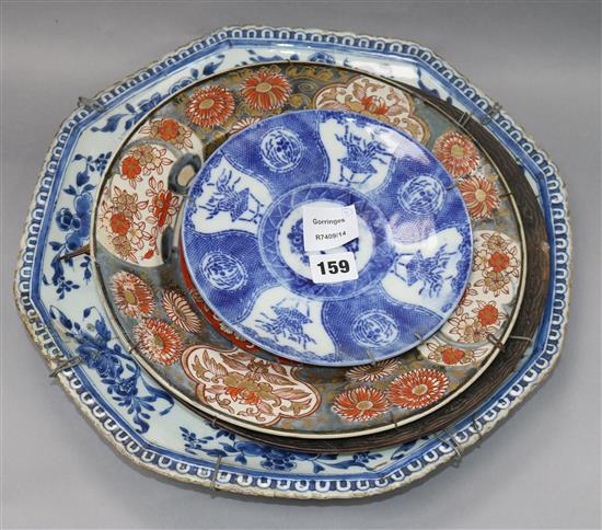 A Kangxi blue and white dish, an Arita dish, a crackleglaze dish and a Japanese blue and white dish largest diameter 40cm